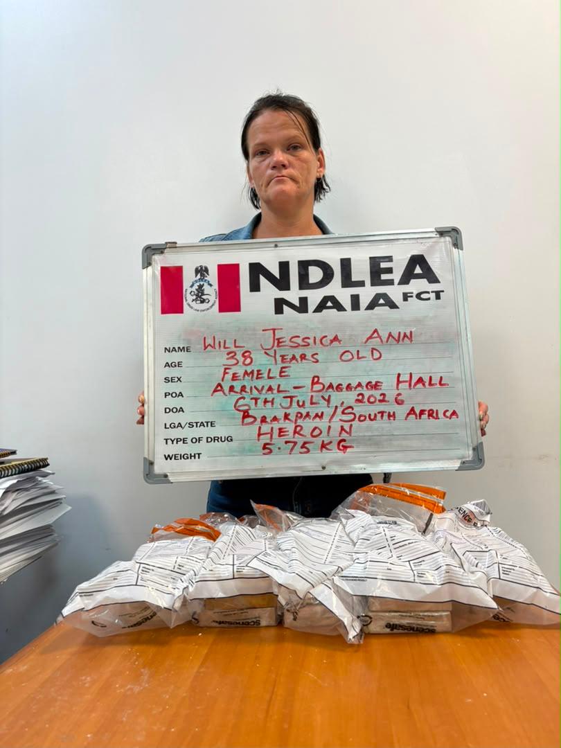 Will Jessica Ann holding an NDLEA identification board beside the reported heroin packages