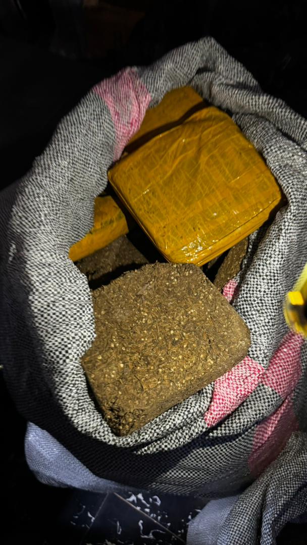 Supplied close-up of dried leaves and wrapped packages reported as suspected cannabis