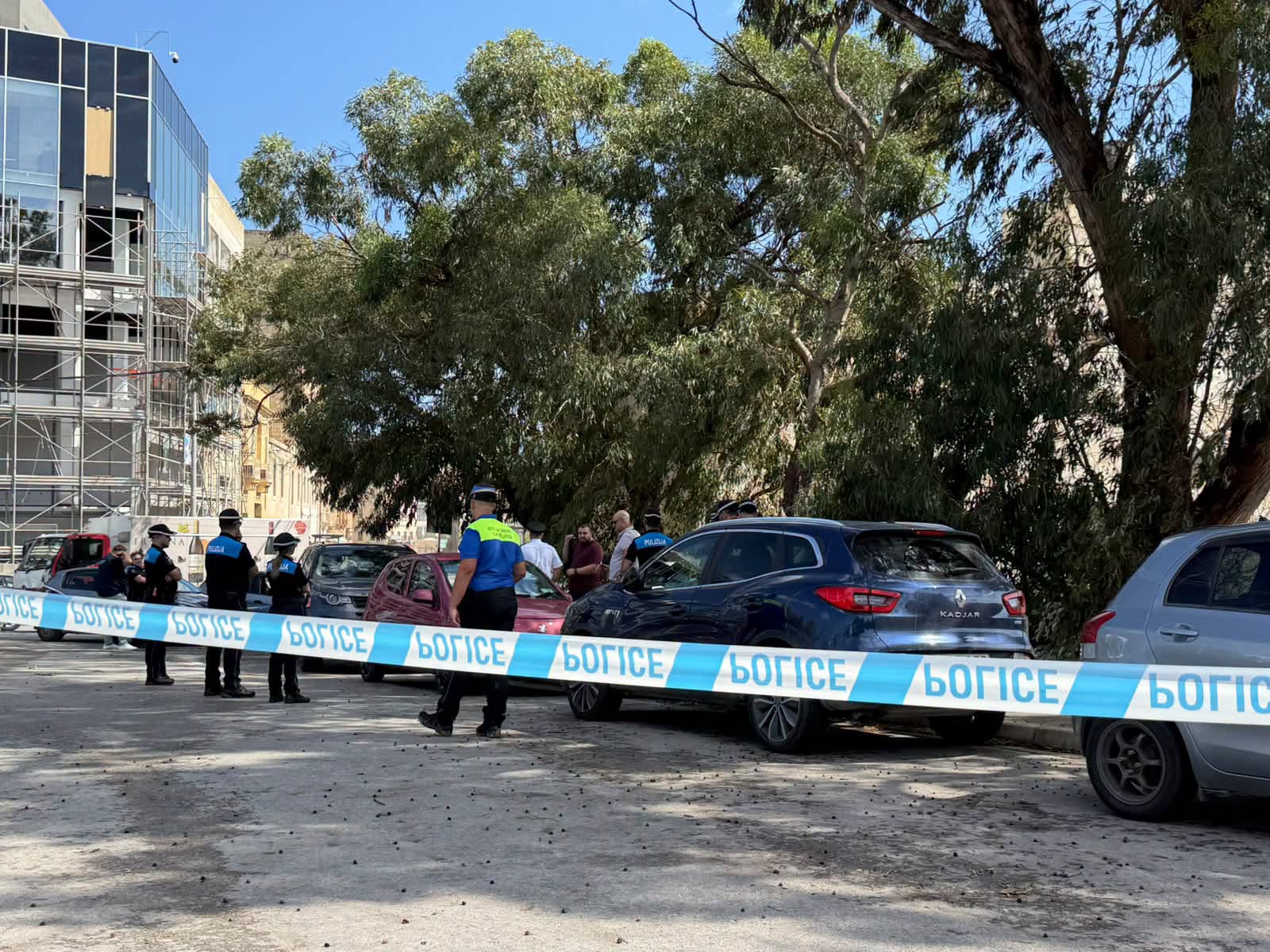 Supplied photograph of Maltese police at a cordoned-off street in Marsa