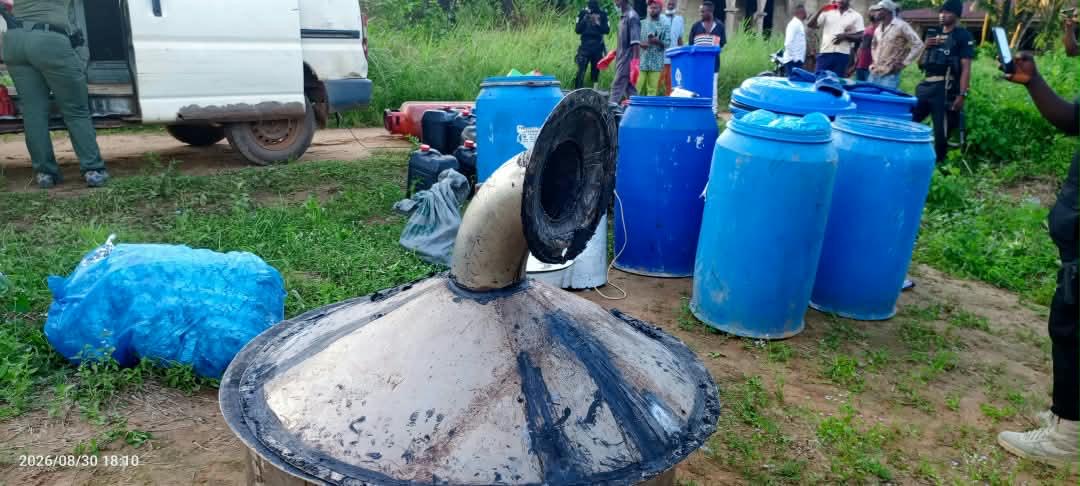 Blue drums and industrial equipment photographed during the reported NDLEA operation