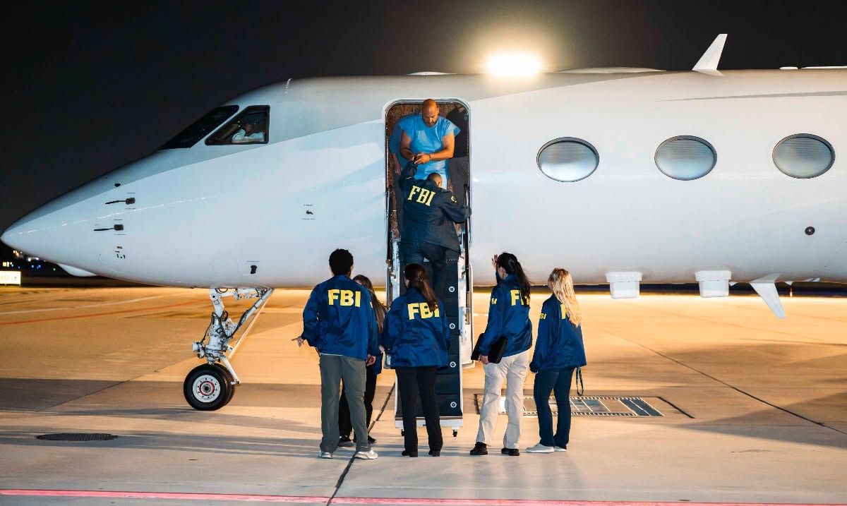 Ibrahim Hilmi boarding FBI aircraft
