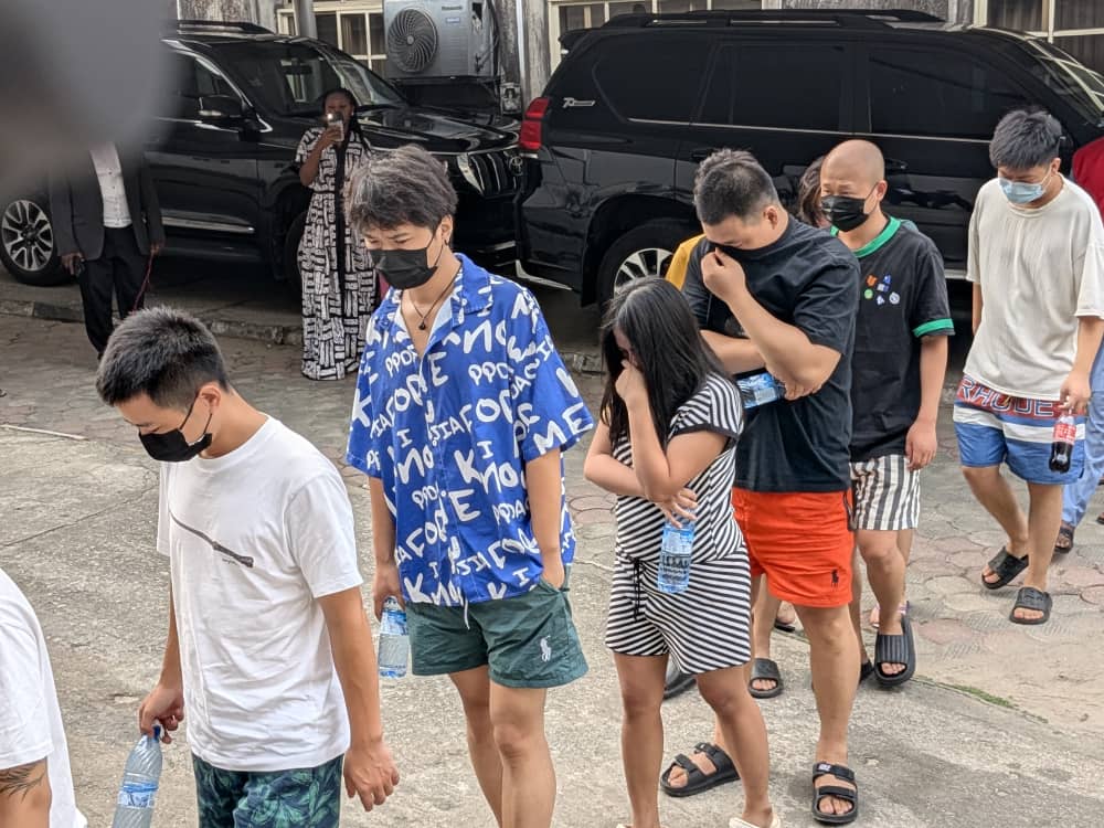Some of the 792 suspects escorted from the Big Leaf Building, Lagos — December 2024